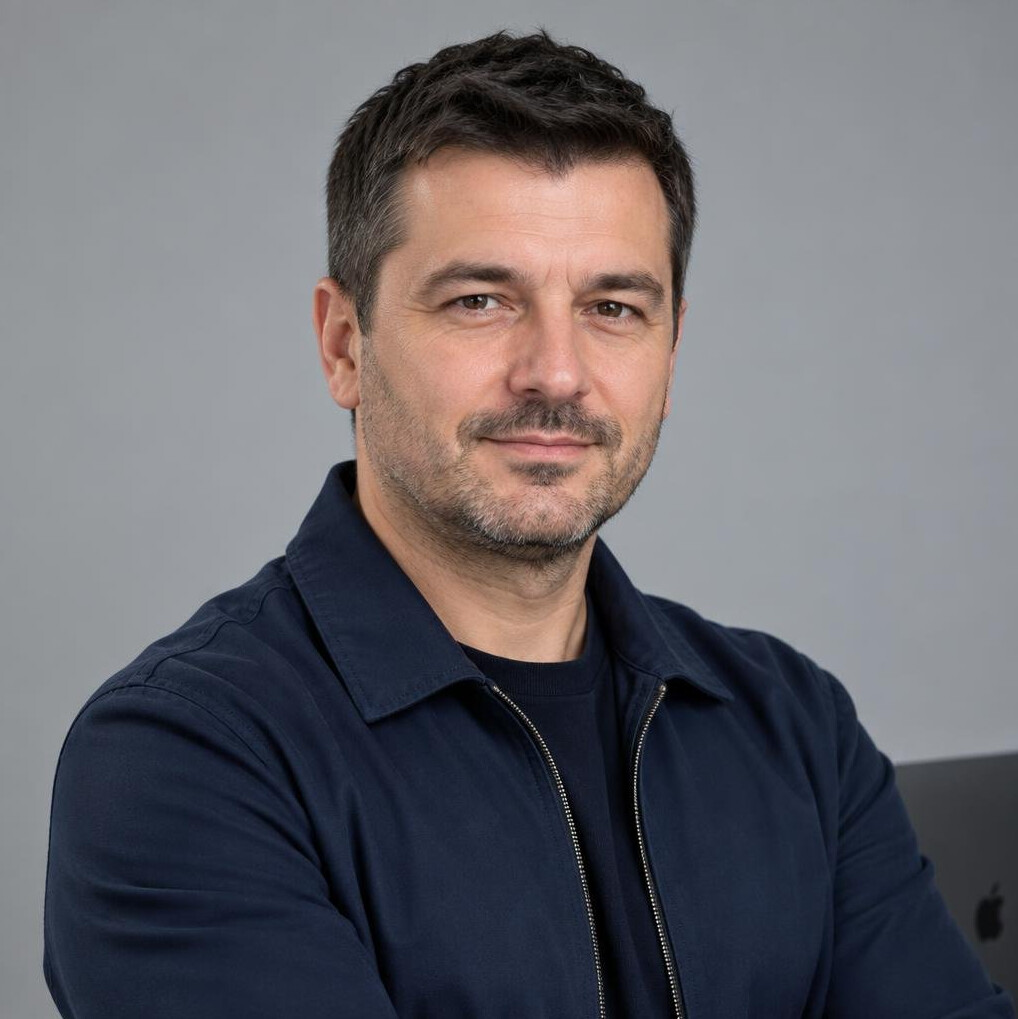 Portrait of a man in a suit jacket with short hair
